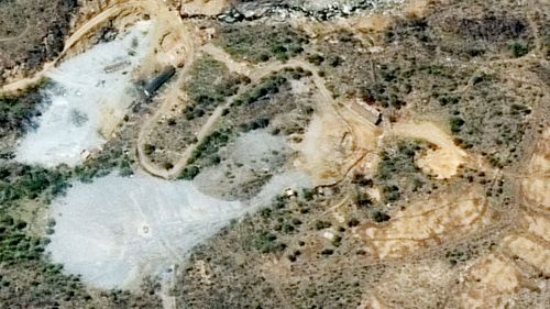 A satellite image shows the mountainside where North Korea has carried out what it says is the demolition of its nuclear test site in the presence of foreign journalists. (AAP)