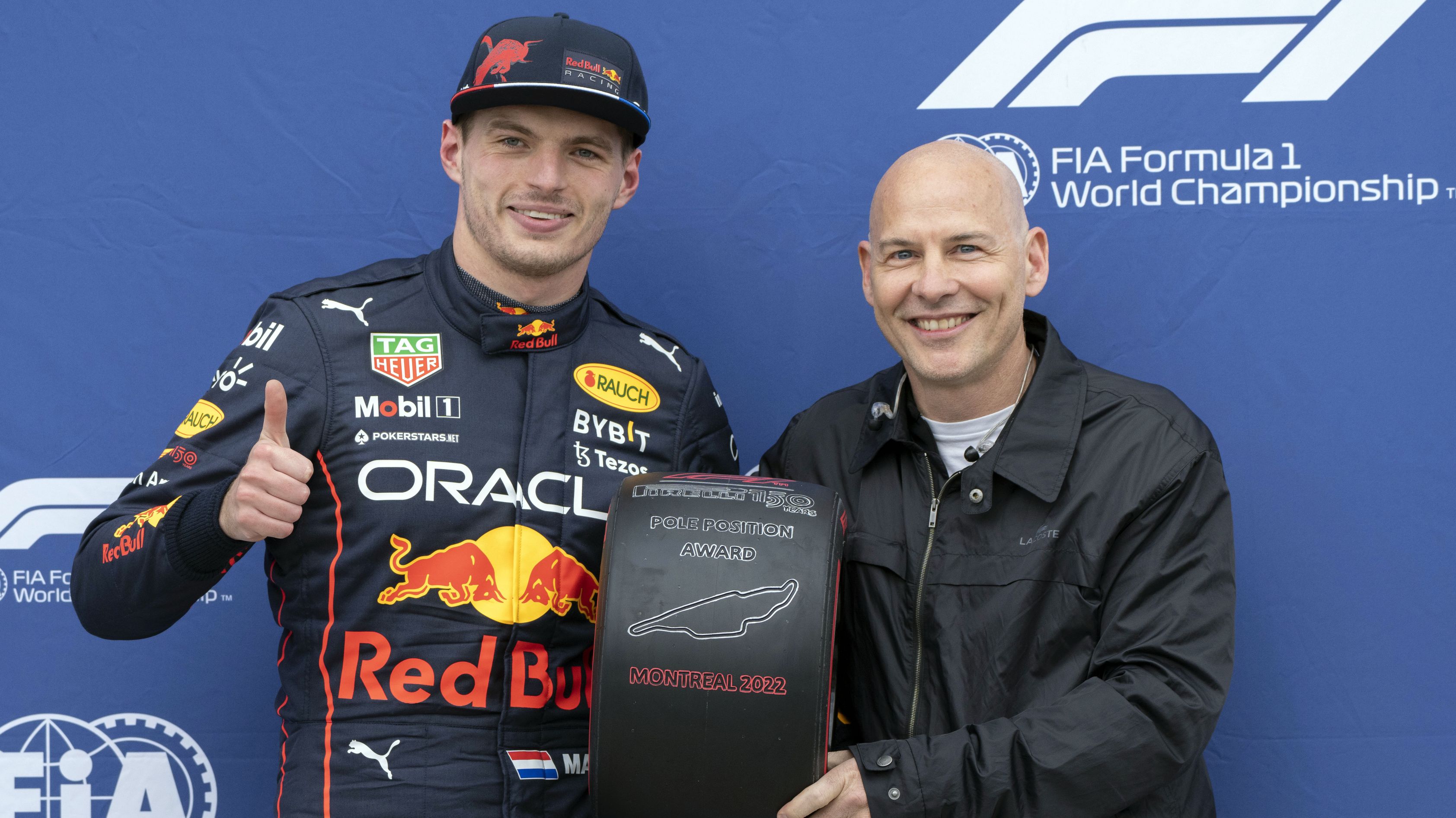 Jacques Villeneuve (right) presents Max Verstappen with the pole position award at the 2022 Canadian Grand Prix.