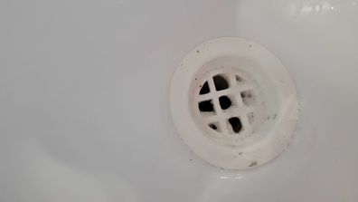 Bathroom basin sink hole cleaning task