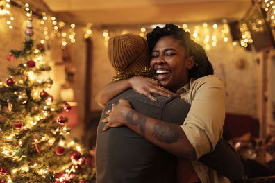 Couple hugging on Christmas eve