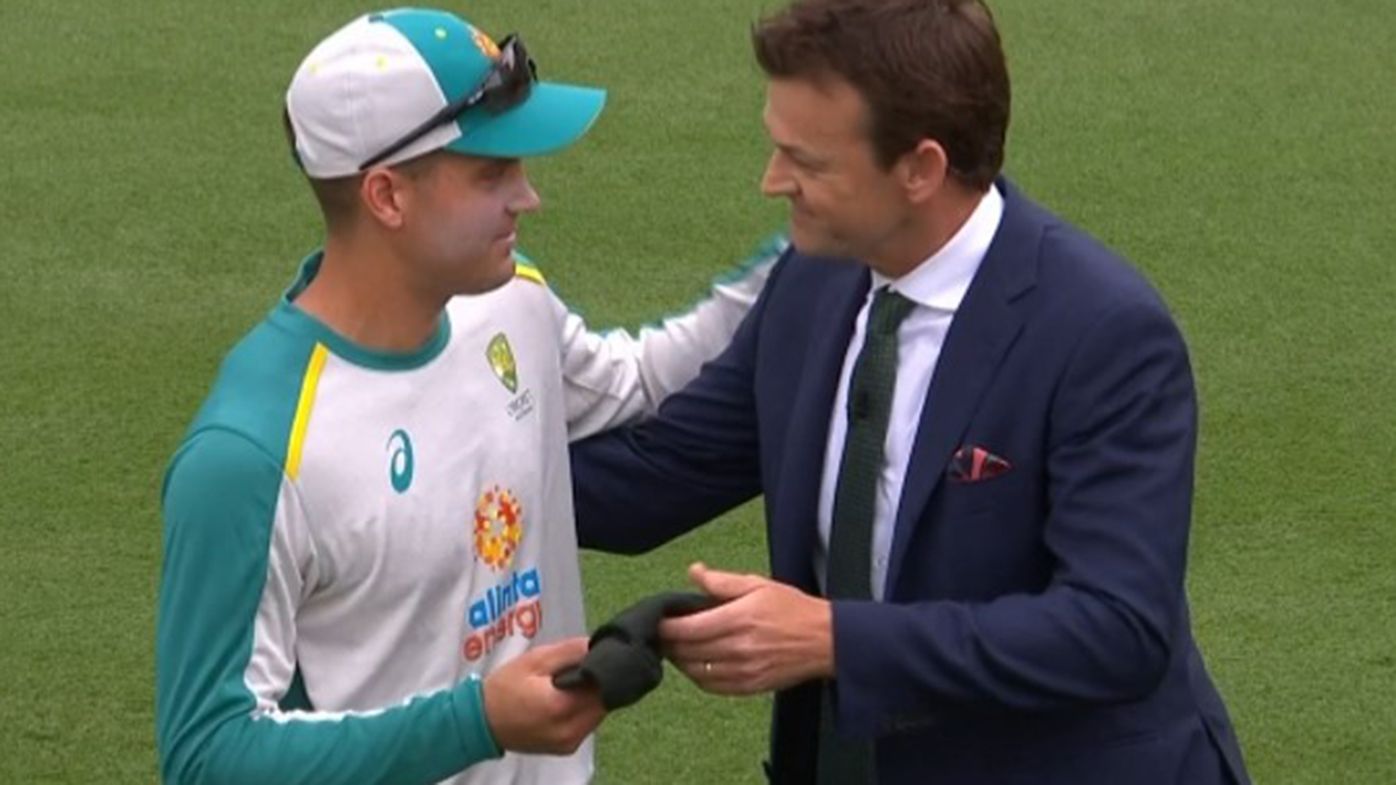 Alex Carey receives his baggy green from Adam Gilchrist.
