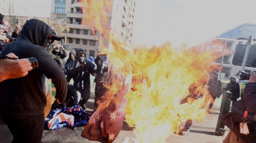 The move comes after violent rallies in Melbourne which saw masked protesters burn an Australian flag. (9NEWS)