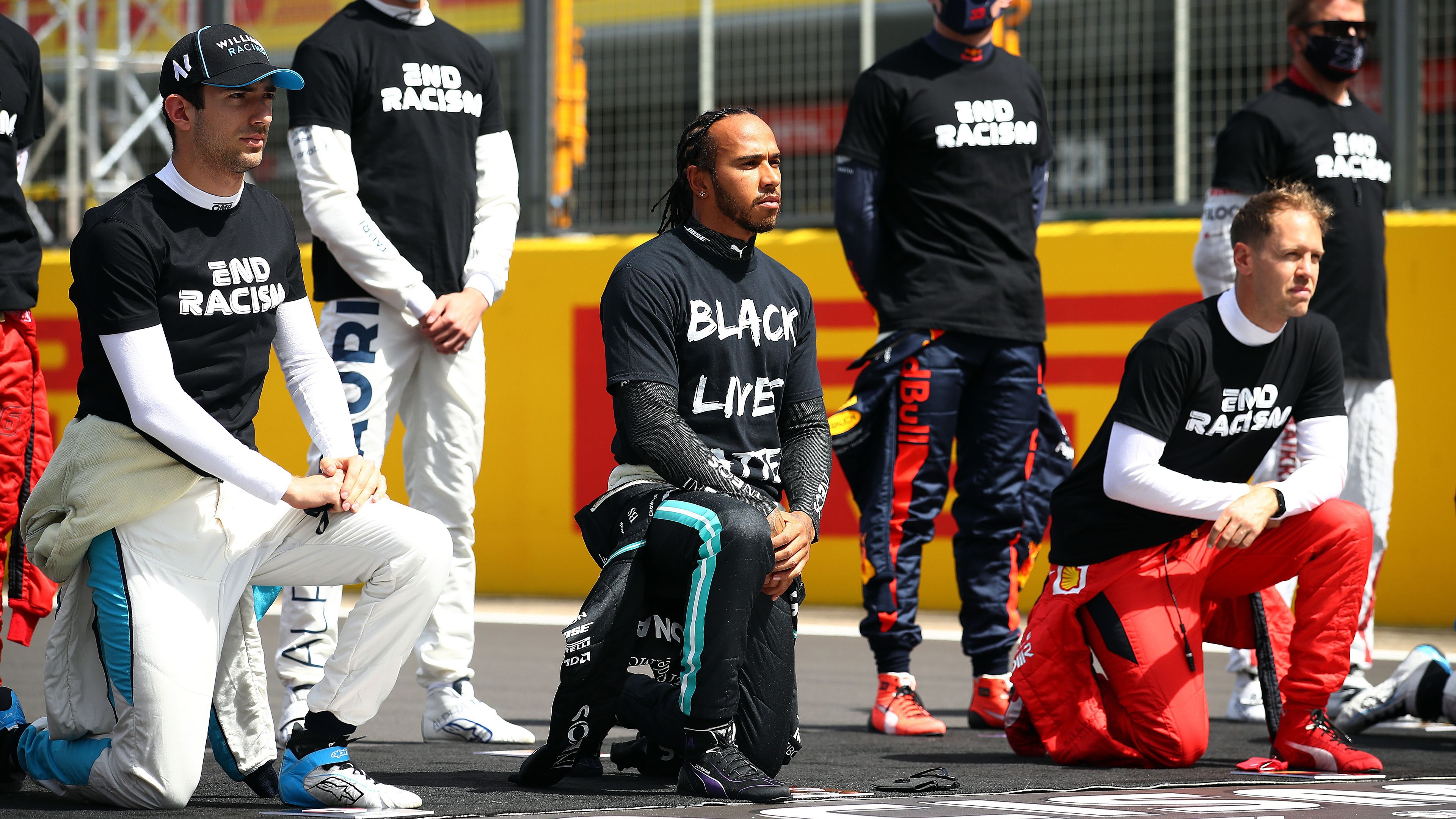 Lewis Hamilton takes a knee on the grid in support of the Black Lives Matter movement prior to the British Grand Prix in 2020.