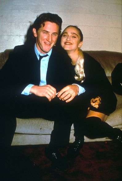 Sean Penn and Madonna relax while attending an AIDS benefit November 11, 1987 in Los Angeles. 