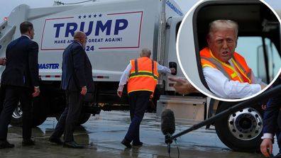 Republican presidential nominee former President Donald Trump talks to reporters as he sits in a garbage truck Wednesday, Oct. 30, 2024, in Green Bay, Wis. (AP Photo/Julia Demaree Nikhinson)