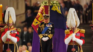 King Charles III stands vigil beside the coffin of his mother, Queen Elizabeth II, as it lies in state on the catafalque in Westminster Hall, at the Palace of Westminster, on September 16, 2022 in London England.