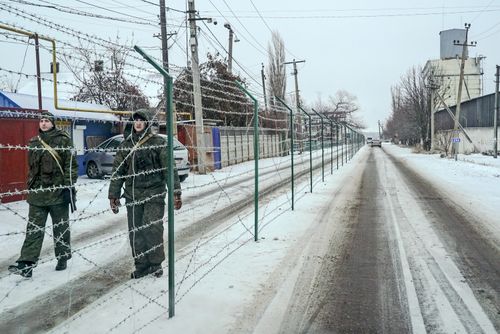The fence was built by Russia earlier this year, preventing residents from routinely crossing the street to speak to neighbours.