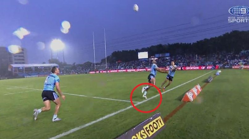 Sharks winger Ronaldo Mulitalo had his toed on the line before batting the ball back in play.