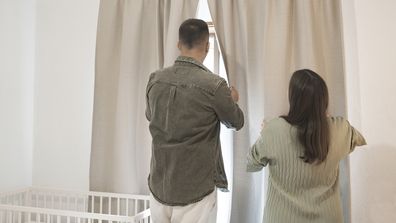 A couple in the baby nursery