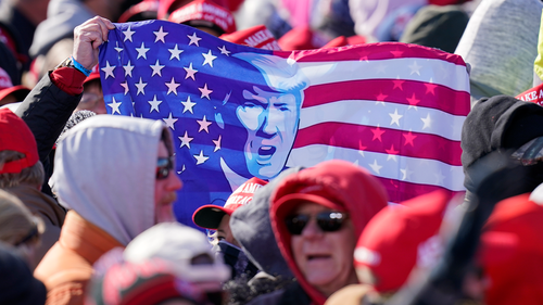 Supporters wait for President Donald Trump to arrive at a campaign rally at Dubuque Regional Airport, Sunday, Nov. 1, 2020, in Dubuque, Iowa. (AP Photo/Charlie Neibergall)