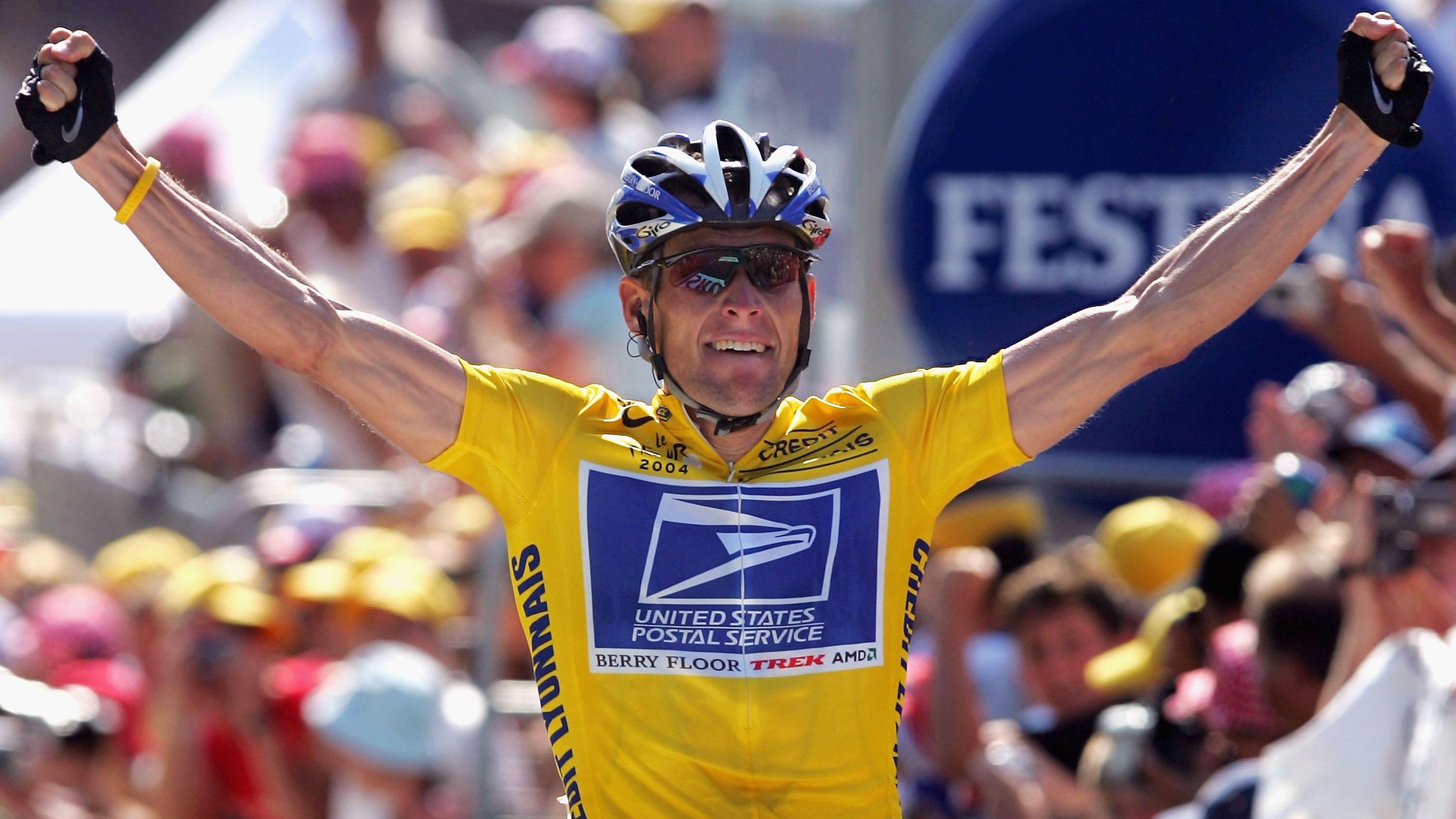 Lance Armstrong celebrates as he wins stage 17 of the Tour de France in 2004.