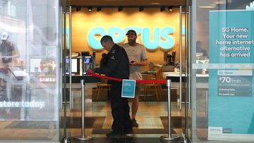 A customer inside an Optus store, one of three big mobile phone companies who have raised prices in Australia over the past 12 months.
