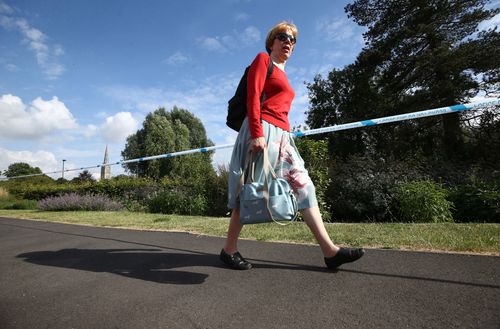 People walk past the park in Salisbury where the latest sick couple visited at the weekend. Picture: AAP