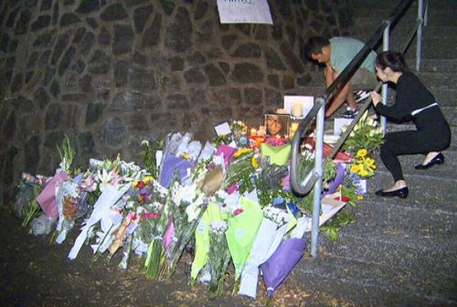 Floral tributes to Eunji Ban are laid on the Wickham Park steps near the scene of her murder.