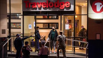 Returned travellers being moved from the Travelodge in Surry Hills last night.