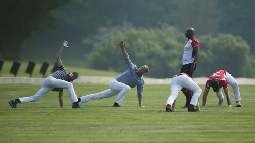 The Duke of Cambridge (second left) warms up with fellow players before the start of the polo match. (PA)