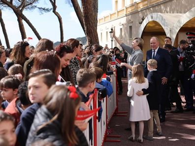 Prince Albert, Princess Charlene, Prince Jacques and Princess Gabriella of Monaco greet crowds celebrating Albert's 66th birthday.