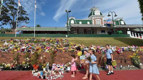 Flower tributes will make up part of a permanent memorial at the park. (AAP)