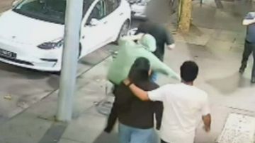 One of the stabbings occurred outside a CBD burger restaurant. Raftopoulos, pictured in the green jumper, is facing 15 charges.