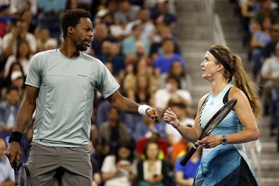 NEW YORK, NEW YORK - AUGUST 23: Gaël Monfils of France (L) reacts with Elina Svitolina of Ukraine (R) during the Stars of the Open Exhibition Match to Benefit Ukraine Relief prior to the 2023 US Open at USTA Billie Jean King National Tennis Center on August 23, 2023 in New York City. (Photo by Sarah Stier/Getty Images)