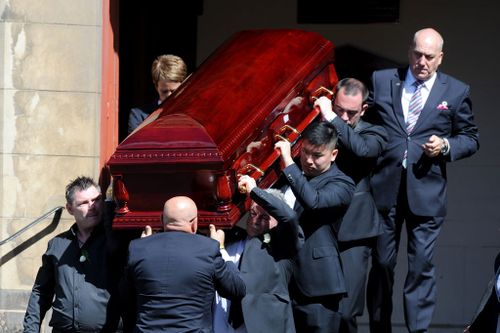 The coffin is carried out of the church. (AAP)