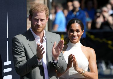 Britain's Prince Harry,, left, and Meghan, Duchess of Sussex, arrive for a visit at the town hall in Duesseldorf, Germany, Tuesday, Sept. 6, 2022. Prince Harry visits the city as ambassador for the Invictus games, a week-long games for active servicemen and veterans who are ill, injured or wounded, hosted by Duesseldorf next year. (AP Photo/Martin Meissner)