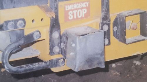 Sager covered the bulldozer shut-off button with metal.