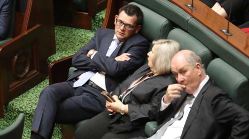 An exhausted Daniel Andrews sits in the Legislative Assembly during the marathon assisted dying debate. (AAP)