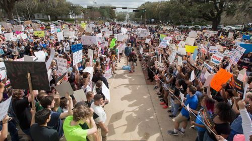 Students gather on the steps of the old Florida Capitol protesting gun violence in Tallahassee, Florida. (AAP)