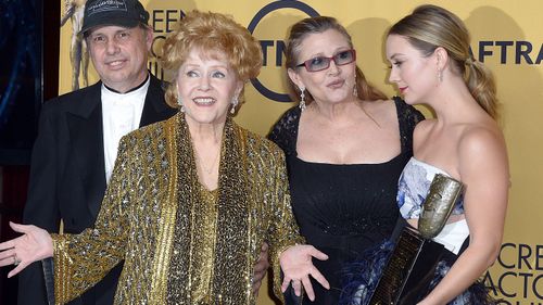 Debbie Reynolds (centre) with her son Todd, daughter Carrie and grand daughter Billie Lourd. (AFP)