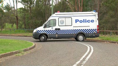 A police van closes the road leading in to the home to assist officers in their investigation.