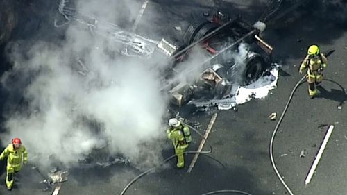 Smoke can be seen billowing from the truck. (9NEWS)