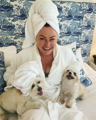 Shelly Horton in bed with her dogs