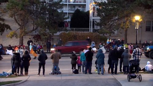 The car was caught on camera speeding past crowds