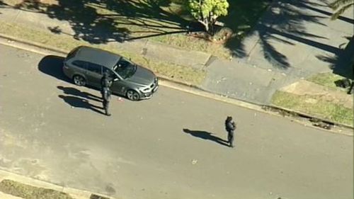 AFP officers are at a home in Bossley Park, in Sydney's west. (9NEWS)