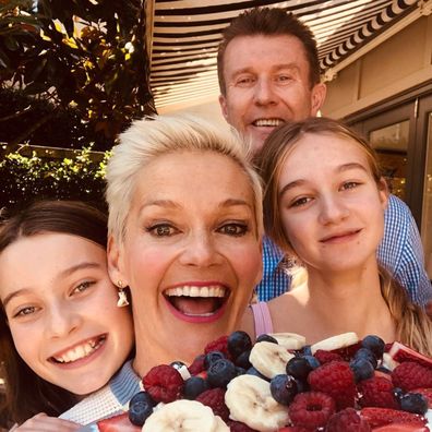 Peter Overton, Jessica Rowe and their two daughters.