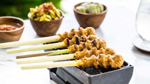 Sate lilit (minced seafood satay) by The Warung at Alila Villas Uluwatu