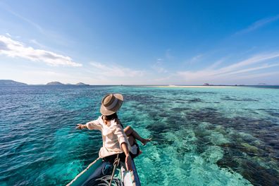 Woman water holiday (Getty/iStock)