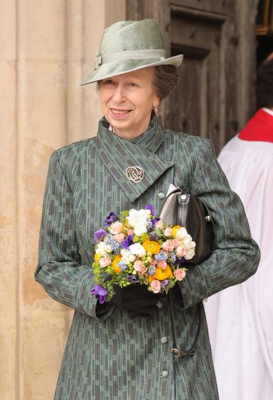 Anne, Princess Royal smiles with a bouquet of flowers as she departs the 2023 Commonwealth Day Service at Westminster Abbey on March 13, 2023 in London 