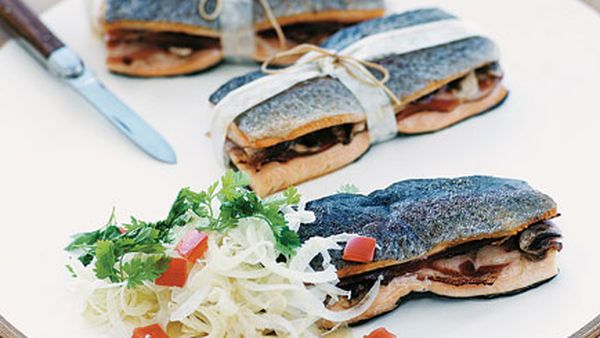 Barbecue trout bundles with prosciutto and button mushrooms