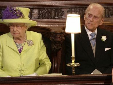 Queen Elizabeth, Prince Philip and Prince William watch the wedding ceremony of Prince Harry and Meghan Markle at St. George's Chapel in Windsor Castle, 2018  