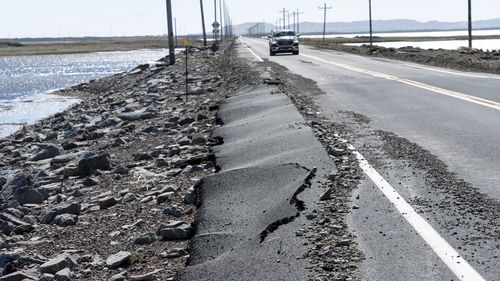 Road damage after Hurricane Fiona at Pointe-aux-Loups is seen on the Les Îles-de-la-Madeleine, Quebec, on Sunday, Sept. 25, 2022. (Nigel Quinn/The Canadian Press via AP)