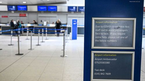 A near-empty check-in counter at Glasgow Airport in Scotland.