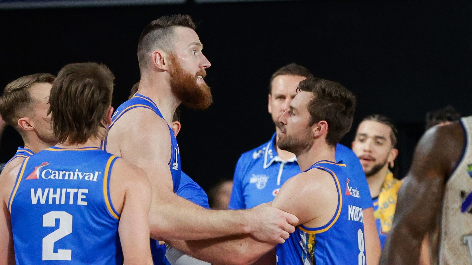Aron Baynes of the Bullets is held back by teammates after exchanging words with officials during the round two NBL match between Brisbane Bullets and Cairns Taipans at Nissan Arena, on October 7, 2023, in Brisbane, Australia. 