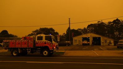 The small village of Bodalla descends into almost darkness at 6.30pm south of Batemans Bay, Saturday, January 4, 2020. The South Coast region on Australia's eastern seaboard, south of Sydney, was devastated on New Year's Eve by bushfire and is under threat again with extreme fire danger, temperatures 40's and strong westerly winds.