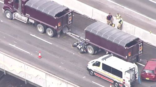 Motorcyclist dies in two truck collision on Sydney’s M4