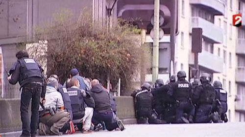 Plain clothes and heavily-armed police near the Kosher grocery store in Paris. (Supplied)