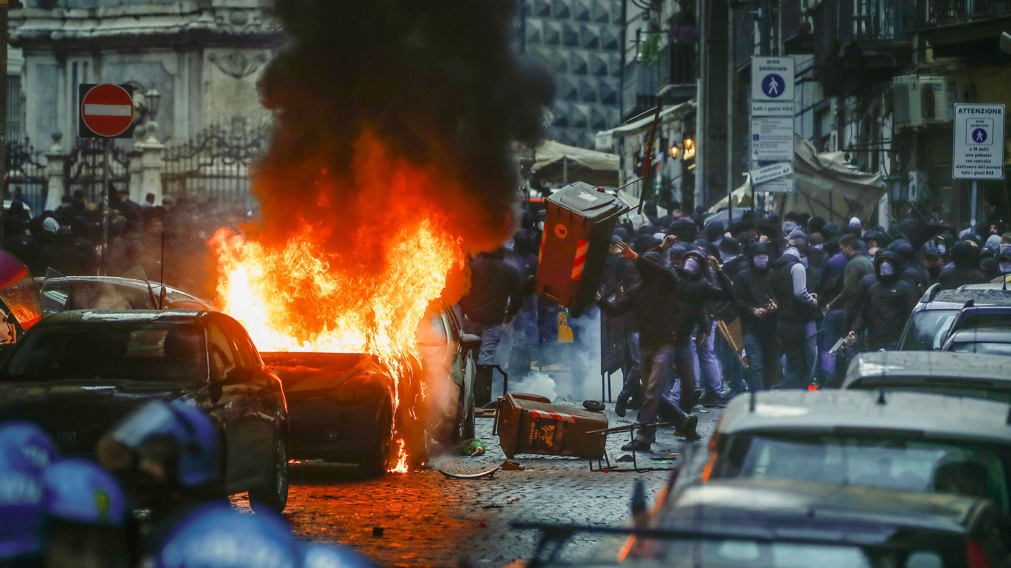 Supporters of Eitracht Frankfurt clash with police in Naples.