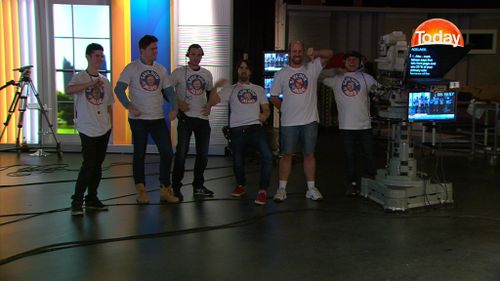 Members of the TODAY show crew wearing the 'Save our Albo' T-shirts. (9NEWS)