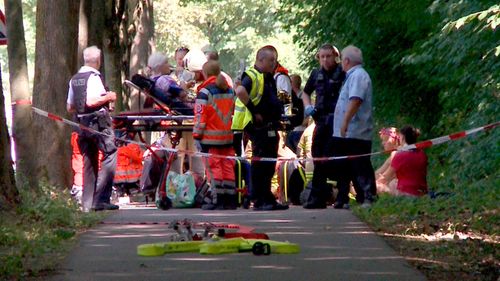 Emergency services attend to passengers injured on a bus in Germany. (AAP)